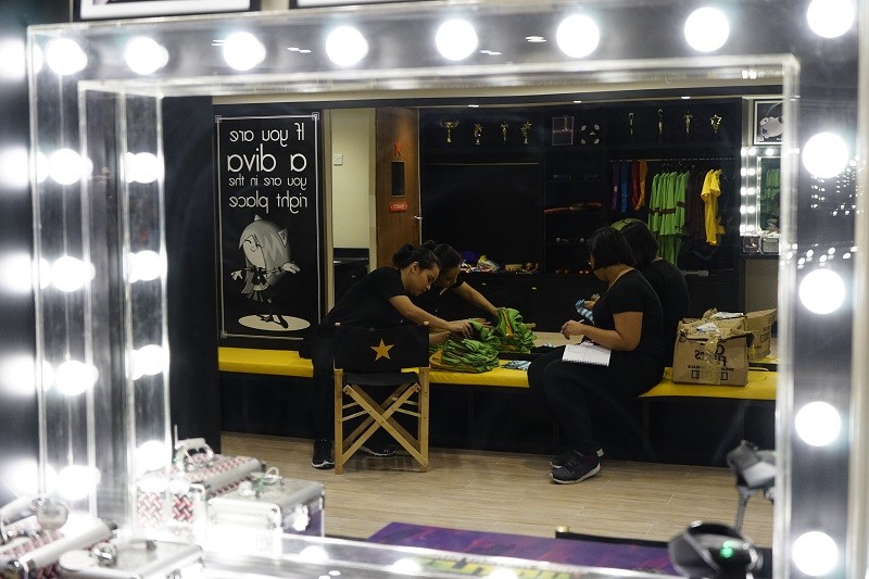 KidZania SG - Zupervisors doing a stock-take on role-play costumes at the Theatre